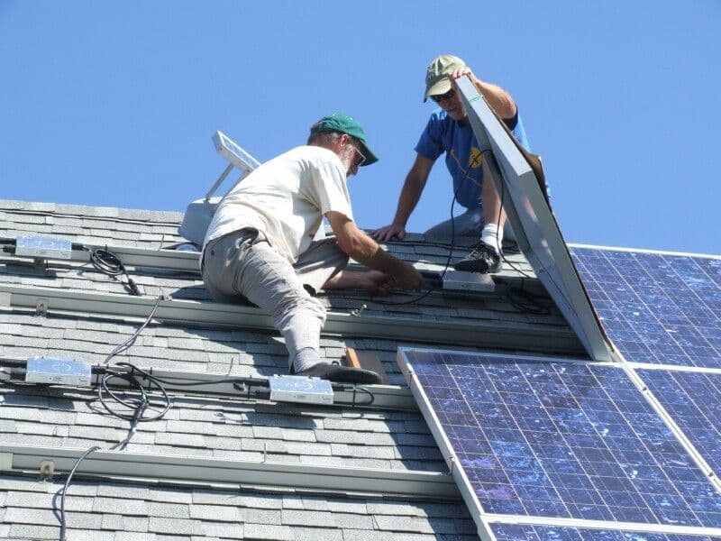 SAF Malabar Energy technicians installing rooftop solar panels
